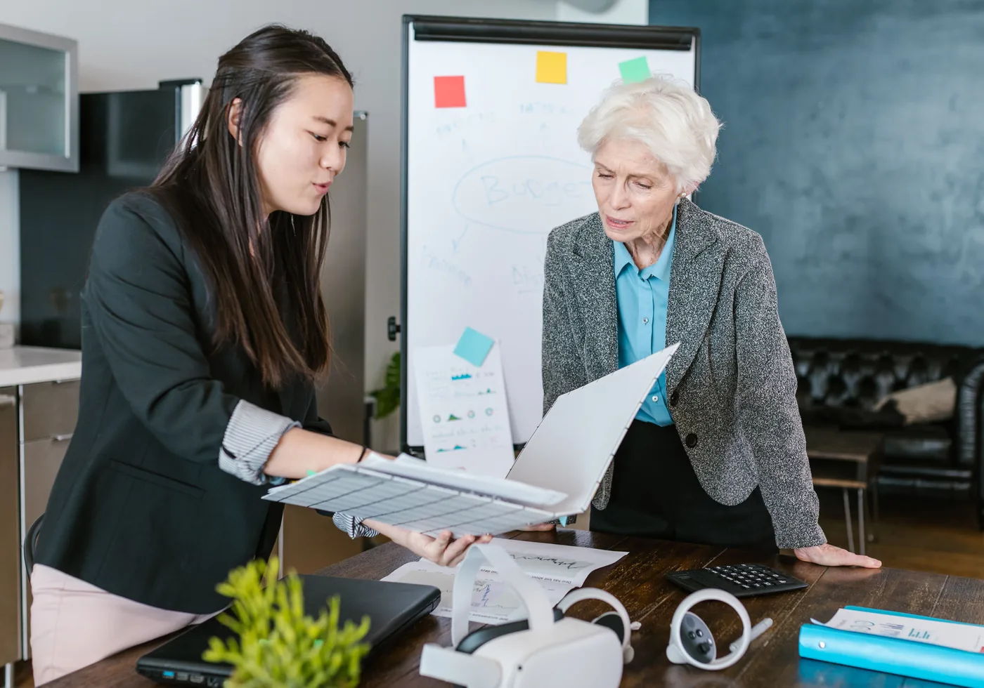 Two business professionals reviewing a proposal together