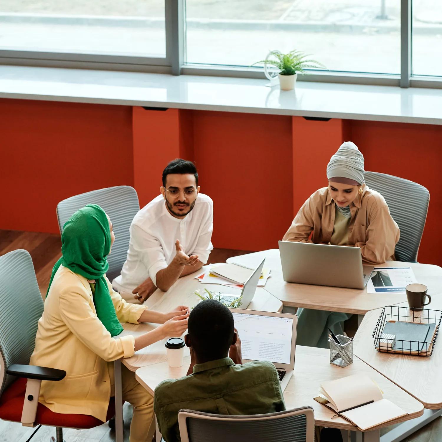 A diverse business team discussing a project in a modern office