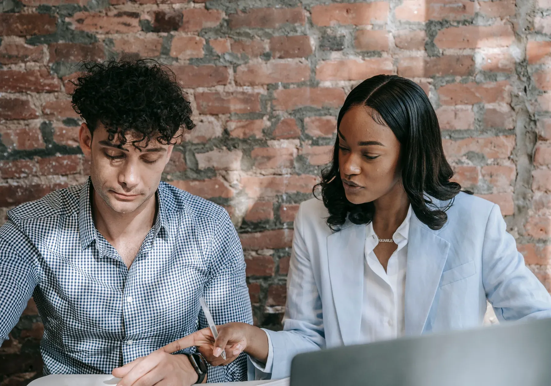 Business partners working together around a laptop during a planning session