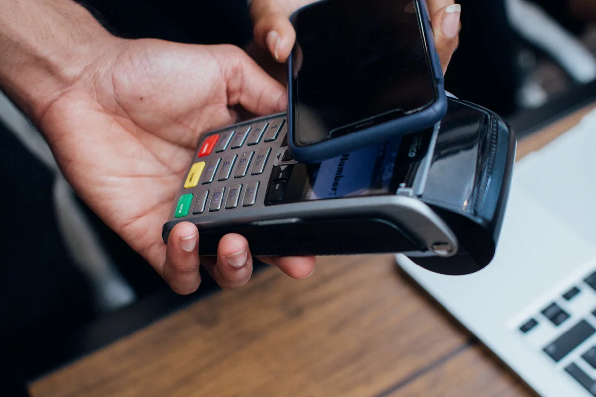 Customer completing a secure mobile payment at a point-of-sale terminal